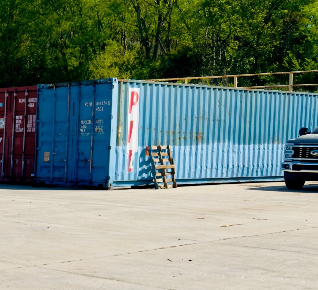 Fenced perimeter behind the container row at the yard